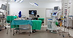 Empty hospital, theater and surgery room for medical emergency, health service and healing facility. Healthcare, interior background or bed with tools and machine for wellness, treatment or procedure