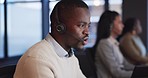 Telemarketing, customer service and man consultant in the office doing online crm consultation. Contact us, headset and professional African male technical support agent working in modern workplace.