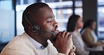 Telemarketing, crm and black man with customer service, telecom sales and communication in workplace. African person, consultant or agent with headset, technical support or help desk with call center