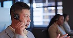 Call center, technical support and man consultant in the office doing online crm consultation. Contact us, headset and professional male customer service agent from Mexico working in modern workplace