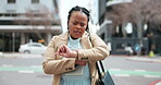 Time, late and a business black woman in the city, looking at her watch while in a hurry or rush. Stress, delay and a young employee walking outdoor in an urban town on her morning commute to work