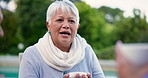 Coffee, garden and a senior woman in conversation with friends during a retirement visit outdoor. Tea, summer and talking with elderly people outside in the backyard of a home together for bonding