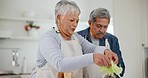 Food, love and a senior couple cooking in the kitchen together for health, diet or nutrition in retirement. Vegetables, ingredients or recipe for a meal with an elderly man and woman in their house