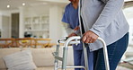Hands, walker and a nurse helping a patient in an assisted living home for senior care or retirement. Medical, healthcare or assistance with a caregiver and elderly person in a house for recovery