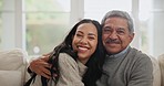 Smile, hug and woman with senior father on sofa for bonding together in the living room. Happy, love and portrait of young female person embracing her elderly dad in retirement at modern home.