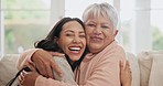 Happy, hugging and face of woman with senior mother on sofa for bonding together in the living room. Smile, love and portrait of young female person embracing her elderly mom in retirement at home.