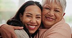 Smile, hug and face of woman with senior mother in the living room for love, care and bonding. Happy, connection and portrait of young female person embracing her elderly mom in retirement at home.