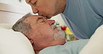 Sick, kiss and senior couple in bed at hospital for rehabilitation, healing or recovery from cancer surgery. Love, elderly man and woman at clinic to visit person sleeping to care, empathy or support