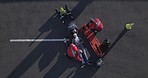 Emergency, road injury and aerial of people on stretcher for accident, first aid and car crash for saving patient. Paramedic, ambulance and emt with person for medical service, care and healthcare