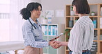 Healthcare, tablet and doctor shaking hands with a patient in the office of a hospital for medical agreement. Handshake, welcome or thank you with a medicine professional meeting a woman in a clinic