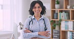 Face, doctor and woman with arms crossed, healthcare and career with stethoscope, consultant and happiness. Portrait, employee and medical professional with ambition, hospital and smile with worker