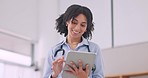 Tablet, smile and woman doctor doing research in hospital for medical diagnosis or treatment. Happy, digital technology and female healthcare worker scroll on the internet for information in a clinic