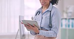 Tablet, closeup and woman doctor doing research in hospital for medical diagnosis or treatment. Online, digital technology and female healthcare worker scroll on internet for information in a clinic.