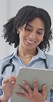 Tablet, smile and woman doctor reading information in hospital for medical diagnosis or treatment. Happy, digital technology and female healthcare worker scroll on internet for research in a clinic.