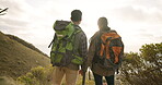 Couple, holding hands and hiking for fitness on mountain, exercise and trekking or adventure in travel. Man and woman, motivation and outdoor journey in nature, health and calm in wellness for peace