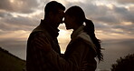 Couple hike, silhouette and love with head touch, sunset and bonding for marriage, support and trust. Happy man and woman, travel and adventure or trekking, peace and romance on trip or vacation