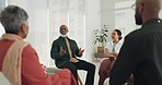 Black man, psychology or therapy meeting in circle for wellness with mental health, help or discussion. Empathy, senior or people speaking for trust, support or communication in counselling therapy