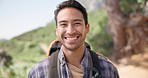 Hiking, nature and face of man on mountain with backpack for adventure, trekking and freedom. Travel, holiday and portrait of happy person smile outdoors walking for wellness, vacation and exercise