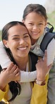 Backpack, hiking and face of mother with girl child in a park with hug, support and care outdoor. Travel, freedom and portrait of kid embrace mom in nature for trekking, adventure and fun exploring