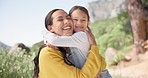 Backpack, hug and mother with child hiking in nature for exploring adventure together. Travel, freedom and happy girl kid embrace mom in a forest for trekking, journey or backpacking fun in Mexico