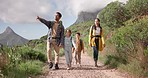 Family hiking, nature and walking in forest for exercise and bonding, parents and kids holding hands with fresh air. Sightseeing, travel and trekking with man, woman and children outdoor in mountains