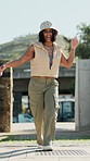 Dance, energy and a woman walking in a garden during summer for freedom or movement in rhythm. Portrait, fashion or sunglasses with a happy young person moving to music in a park for stress relief