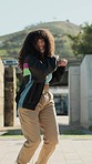 Dance, energy and a hip hop woman walking in a park during summer for freedom or movement in rhythm. Portrait, smile or happy with a confident young person moving to a music beat for stress relief