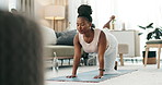 Yoga, legs or black woman stretching in home or house studio for wellness, peace or balance. Pilates, flexible or zen African person in donkey pose for energy training, breath or holistic exercise 