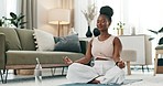 Yoga, lotus or black woman in meditation in home praying for wellness, calm peace or balance. Lounge, relax or zen African person in pilates pose for energy training, breathe or holistic exercise  