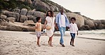 Happy family, together and walk for relaxing on beach for summer vacation in Cape Town. Black man, woman and children with excited smile for travel, trip or holiday to coast with love, care or bond