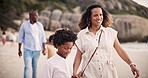 Walking, happy family on beach together talking and bonding on tropical adventure holiday. Conversation, summer vacation and mother, father and children at ocean to relax, smile and holding hands.