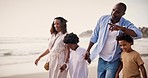 Family, together and pointing with walk on beach with vacation, travel or trip to Cape Town. Black man, woman and kids with showing, horizon or scenery at sea for learning, information or education