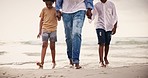 Holding hands, legs of family at ocean together for holiday and bonding on tropical adventure in waves. Walking, summer vacation and father with children on beach to relax, travel and fun in Cancun.