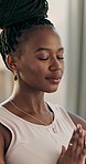 Yoga, praying or face of black woman in meditation in home studio for wellness, peace or balance. Calm, relax or zen African person in pilates pose for energy training, breathe or holistic exercise