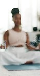 Yoga, incense smoke and a black woman on the floor of a living room in her home for health or wellness. Exercise, pilates and zen meditation with a young person in her apartment for mindfulness