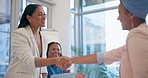 Happy business people, handshake and applause in meeting for partnership, b2b or agreement at office. Woman shaking hands or clapping for teamwork or introduction in hiring or recruiting at workplace