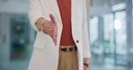 Business woman, handshake and office for b2b, deal or agreement in hiring, meeting or greeting. Closeup of female person shaking hands for recruiting introduction, teamwork or thank you at workplace