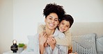 Happy, face and child hugging mother on bed for relaxing, bonding and resting together at home. Smile, excited and portrait of boy kid embracing his young mom from Mexico in bedroom in family house.