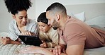 Tablet, relax and family on bed networking on social media, mobile app or the internet together. Happy, smile and young mother and father watching video on digital technology with boy child at home.