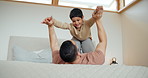 Man, boy and child on bed with plane, fantasy and childhood game for freedom, happiness and bond in home. Family, father and son in bedroom with flying, lifting and smile for love, care and support