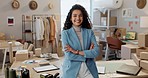 Designer woman, arms crossed and face at workshop, pride or entrepreneurship by boxes for e commerce. Small business owner, clothes and package for shipping, supply chain and smile at fashion startup