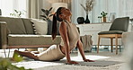 Fitness, yoga and woman stretching for relax on living room floor, balance and wellness. Indian girl, mindset and chakra training with exercise for flexible body, pilates and zen or peace at home