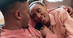 Home, love and black couple conversation, hug and discussion about marriage, relationship story or gossip. Living room couch, face and relax husband, wife or African people bond with romantic care