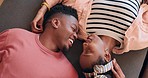 Top view, floor and happy couple laughing, relax and playful with eyes closed at home together. Above, love and face of black people in a living room with joke, conversation and romance in a house