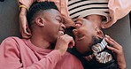 Love, happy and couple on a floor bonding, laugh and care with nose touch intimacy from above. Top view, smile and playful black people share romance, support or communication, care and relax at home