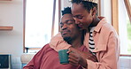 Coffee, hug and couple in a home talking together in the morning as care, happiness and calm in a kitchen. Happy, African and man bonding with woman in an apartment as support and in conversation