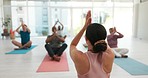 Yoga class, instructor and woman in namaste for meditation, relax and peace. Meditate, group and back of coach with prayer hands pose for fitness, exercise and body health, spiritual wellness and zen