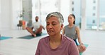 Yoga class, woman and meditation for mental health, calm and zen mindfulness in chakra, aura and holistic. Senior person, fitness and breathing exercise in retirement, self care and inner balance