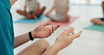 Yoga, hands and person in class for fitness, exercise and communication with wellness and peace. Pilates, closeup and team in studio or center with discussion for instructions, support and meditation