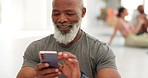 Smart watch, meditation and senior man with a smartphone, yoga and typing with progress, challenge or fitness. Old person, pensioner or mature guy with a cellphone, check time or exercise with health